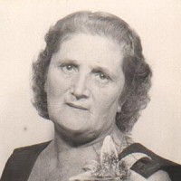 Lydia Catlett Unsmiling older woman with dark gray hair